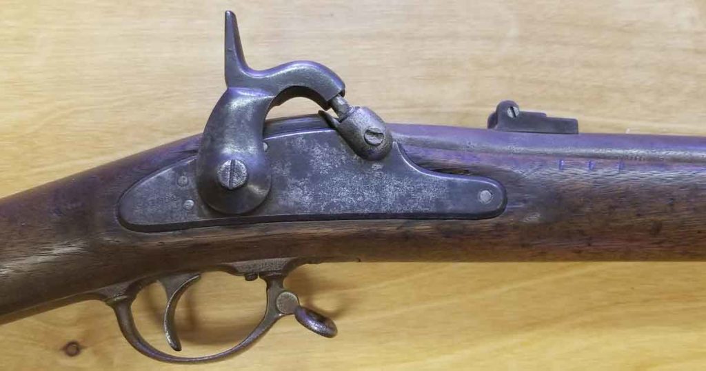 Sweetwater County Museum Employees Examine Civil War Rifle