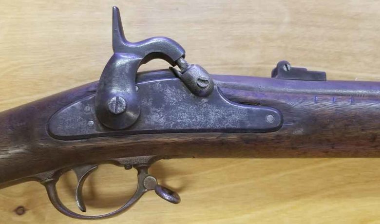 Sweetwater County Museum Employees Examine Civil War Rifle