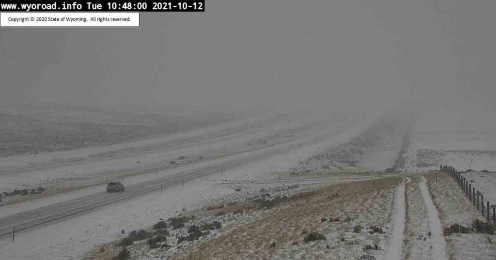 PHOTOS: First Storm of Season Brings Road Closures, Travel Warnings