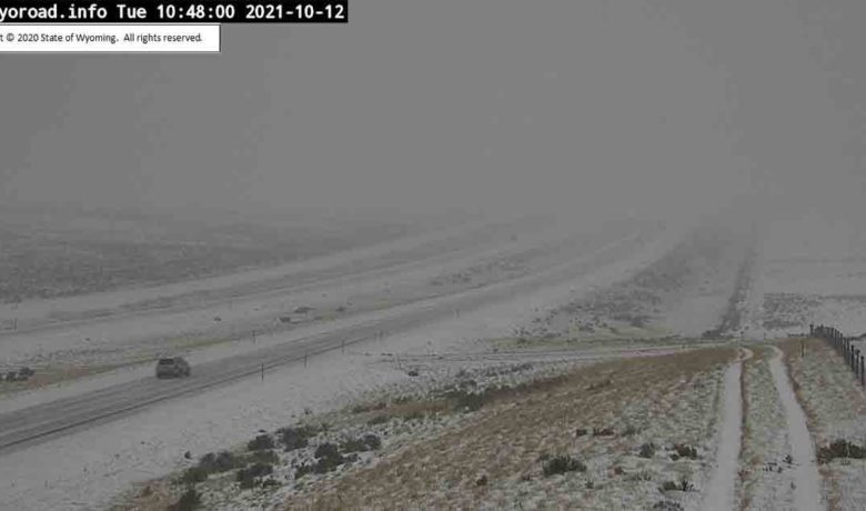 PHOTOS: First Storm of Season Brings Road Closures, Travel Warnings