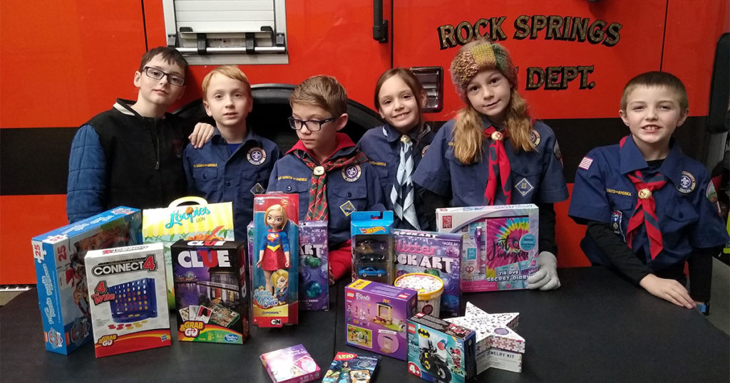 Cub Scouts Give Donations to Toys for Kids Program