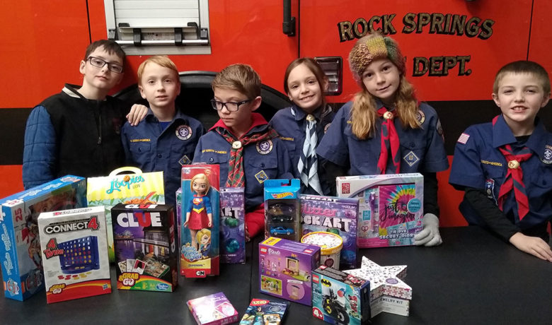 Cub Scouts Give Donations to Toys for Kids Program