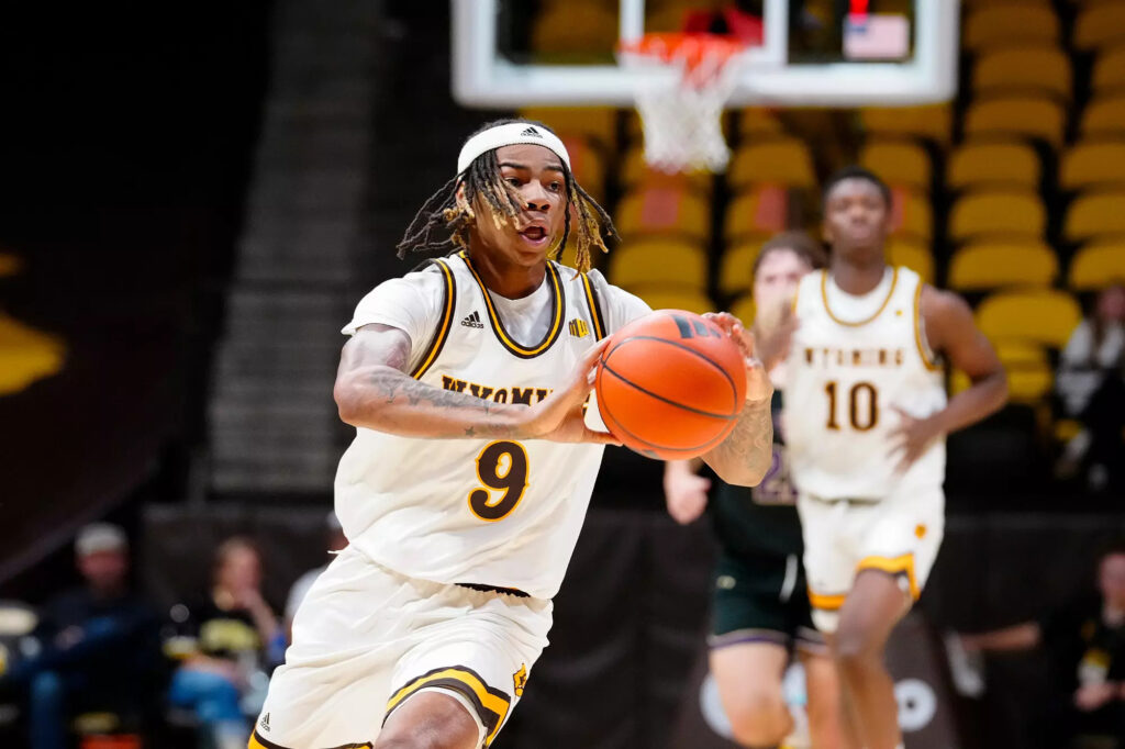 Cowboys Cruise Past Northern State 99-75 in Season Opener