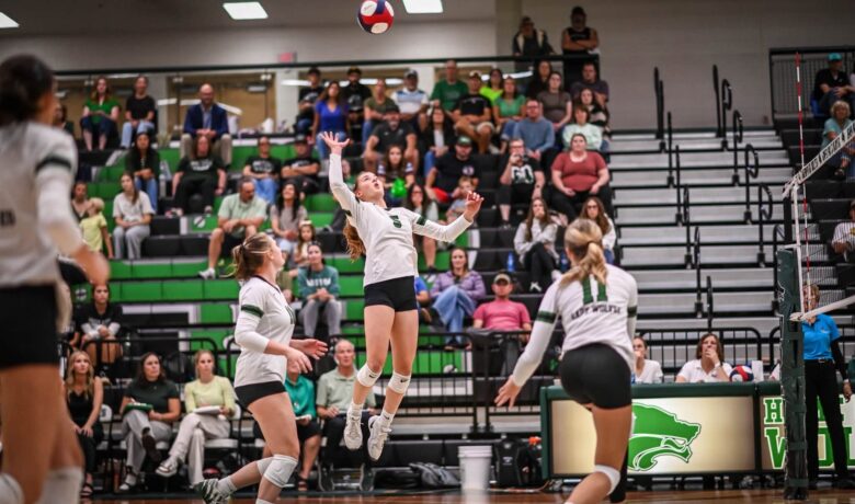 Lady Wolves Rally Past Evanston in Four Sets